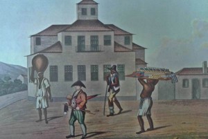 Vendedor ambulante com escravo no Rio de Janeiro, 1819-1820, em litografia colorida a partir de desenho de Henry Chamberlain, tenente da Artilharia Real